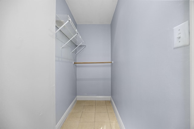 spacious closet with light tile patterned flooring