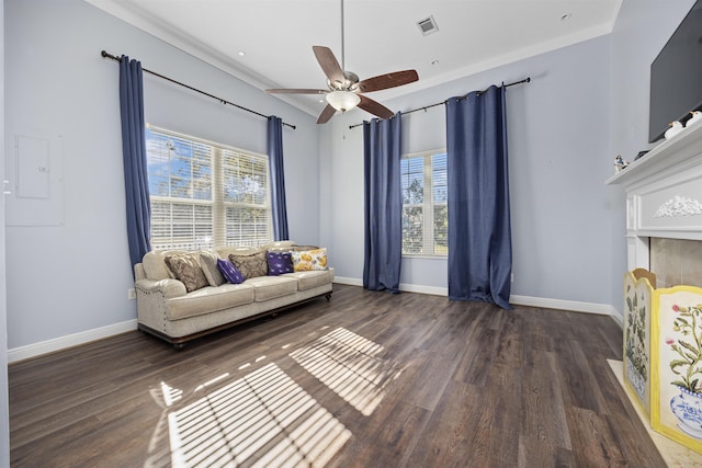 living room featuring ceiling fan, dark hardwood / wood-style flooring, and ornamental molding