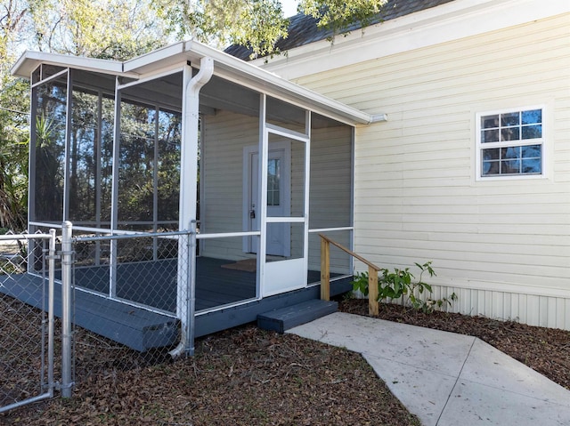 view of side of property featuring a sunroom