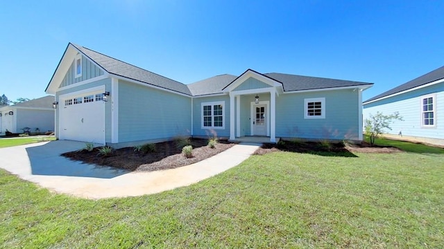 single story home with a garage and a front lawn