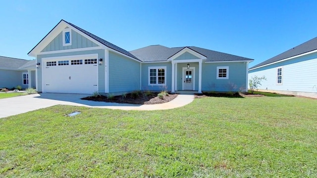 view of front of house featuring a garage and a front yard