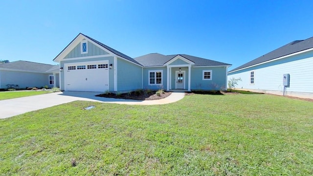 view of front of property featuring a garage and a front lawn