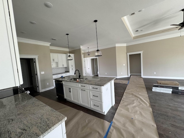 kitchen featuring a sink, baseboards, dark wood-style flooring, dishwasher, and ornamental molding