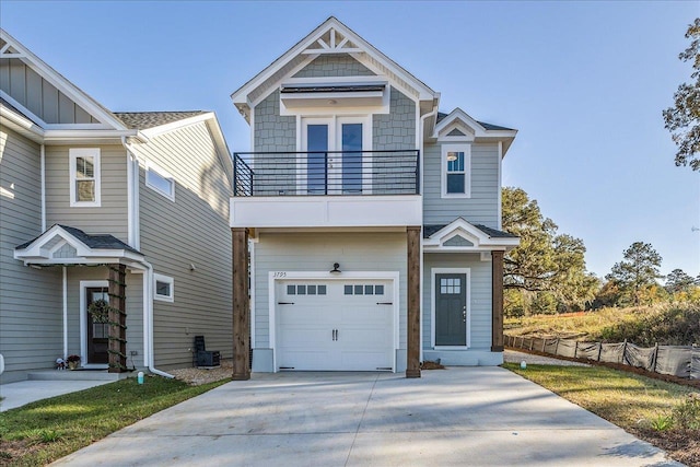 view of front of property featuring a garage and a balcony