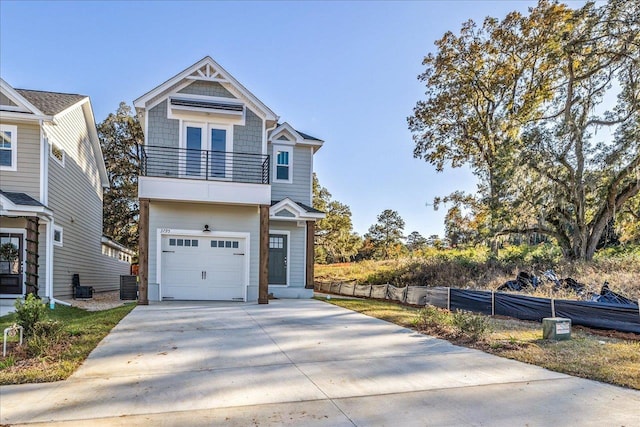 view of front of home with cooling unit, a balcony, and a garage