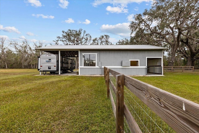 view of front of home with a front lawn and a carport