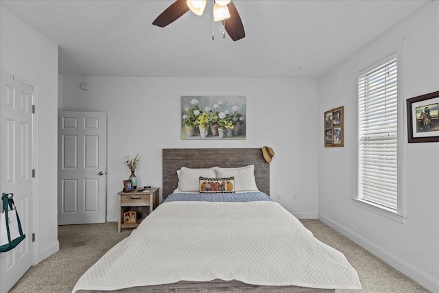 bedroom featuring ceiling fan and light carpet