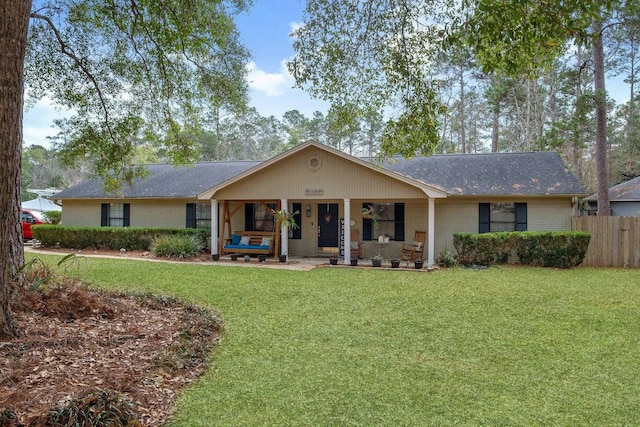 single story home featuring an outdoor living space and a front yard