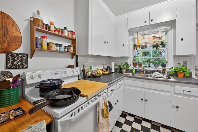 1454 S Gadsden St -, Unit Tallahassee, FL 32301 - kitchen featuring electric range, tile patterned floors, white cabinetry, backsplash, and dark countertops