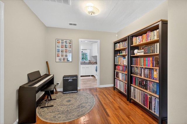 1454 S Gadsden St -, Unit Tallahassee, FL 32301 - sitting room with wood finished floors and baseboards