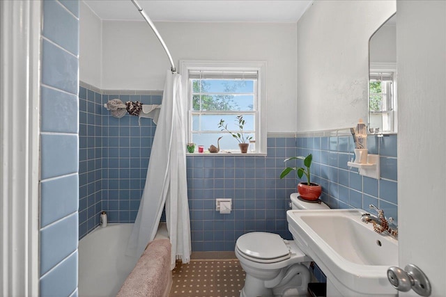 1454 S Gadsden St -, Unit Tallahassee, FL 32301 - full bath featuring tile walls, shower / tub combo with curtain, and a wainscoted wall