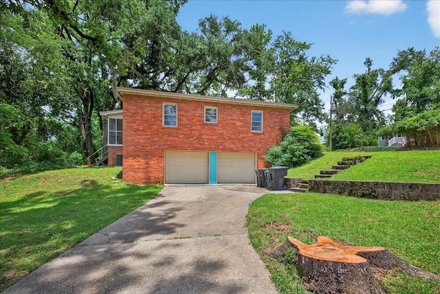 1454 S Gadsden St -, Unit Tallahassee, FL 32301 - view of front of property featuring brick siding, stairway, an attached garage, driveway, and a front lawn