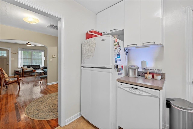1454 S Gadsden St -, Unit Tallahassee, FL 32301 - kitchen with white appliances, white cabinets, ceiling fan, arched walkways, and light wood-style flooring