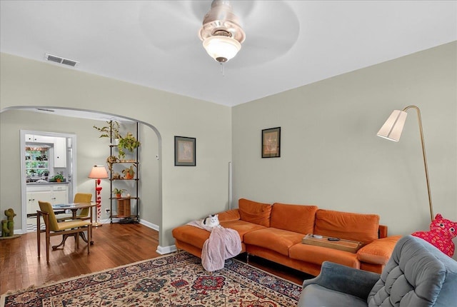 1454 S Gadsden St -, Unit Tallahassee, FL 32301 - living room with arched walkways, wood finished floors, and ceiling fan