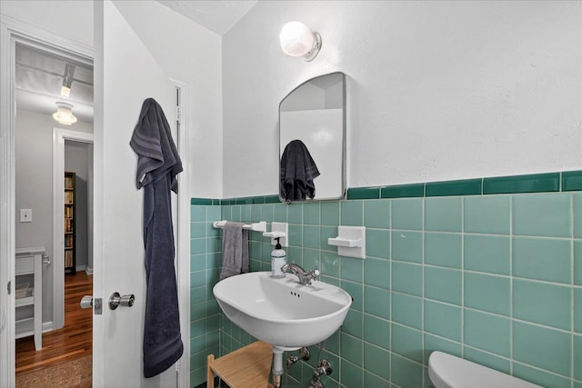 1454 S Gadsden St -, Unit Tallahassee, FL 32301 - bathroom with tile walls, wood finished floors, and wainscoting