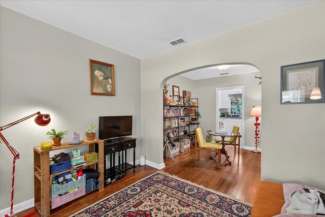 1454 S Gadsden St -, Unit Tallahassee, FL 32301 - living area with arched walkways and wood finished floors