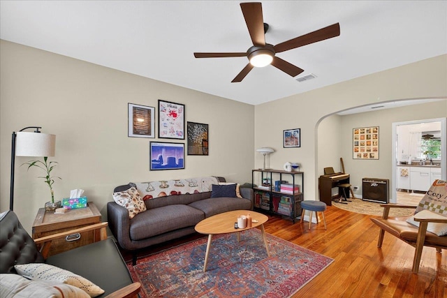 1454 S Gadsden St -, Unit Tallahassee, FL 32301 - living area featuring a ceiling fan, light wood-type flooring, and arched walkways
