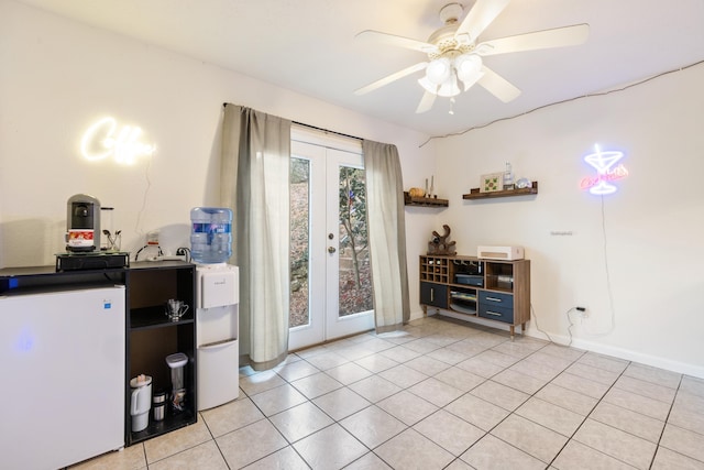 doorway to outside featuring french doors, ceiling fan, and light tile patterned flooring