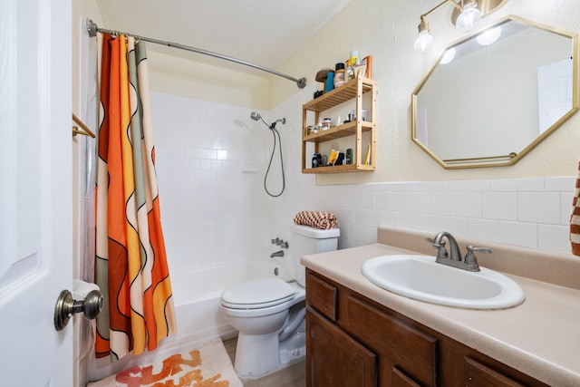 full bathroom featuring tile walls, vanity, shower / bath combination with curtain, and toilet