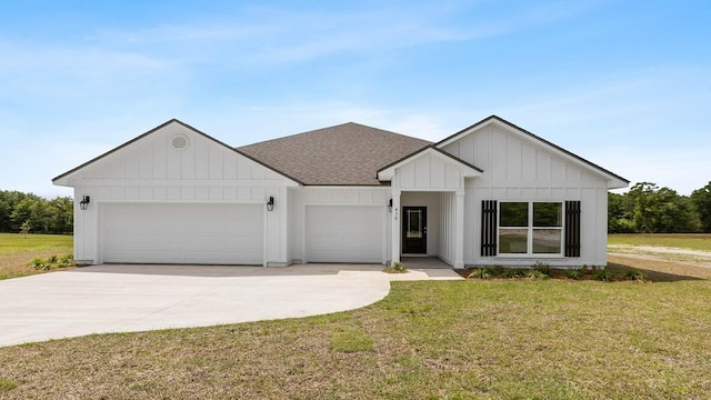 modern farmhouse style home featuring a garage and a front yard