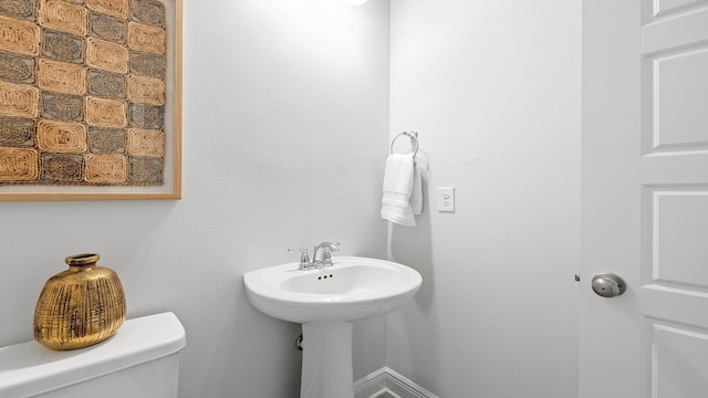 bathroom featuring toilet