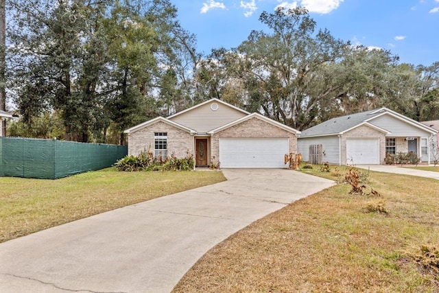 single story home with a front yard and a garage