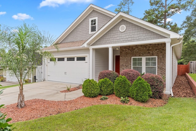 view of front facade featuring a front yard and a garage