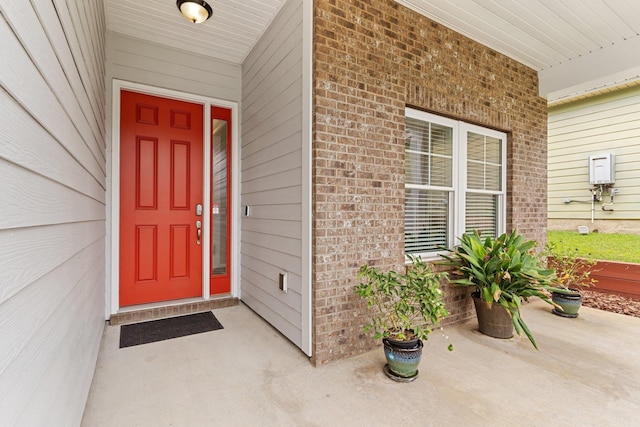 doorway to property featuring covered porch