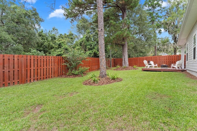 view of yard featuring a wooden deck