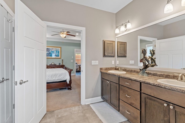 bathroom with ceiling fan, tile patterned flooring, and vanity