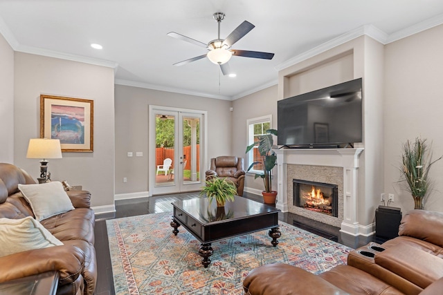 living room with ceiling fan, ornamental molding, and dark hardwood / wood-style floors