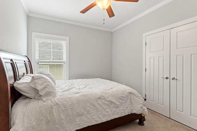 carpeted bedroom featuring ornamental molding and ceiling fan