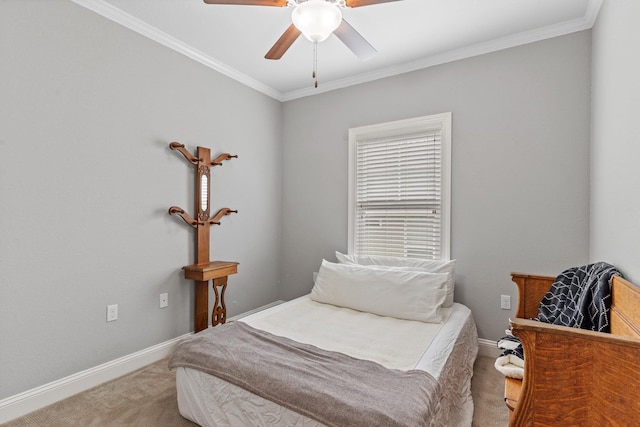 carpeted bedroom featuring ornamental molding and ceiling fan