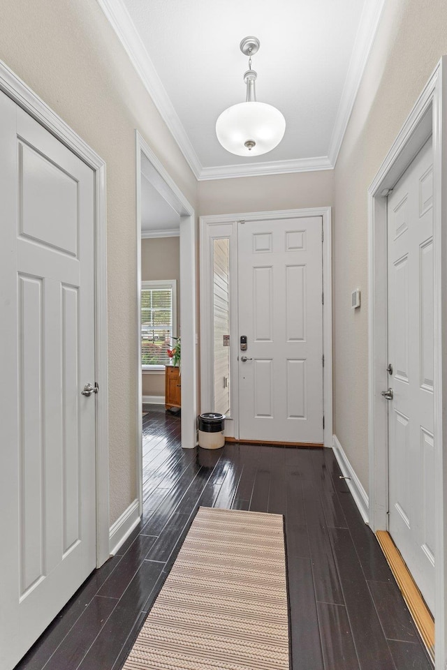 entryway featuring crown molding