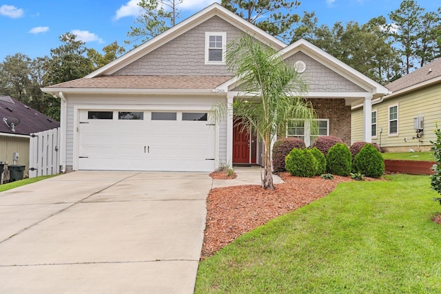 craftsman-style house with a front yard and a garage