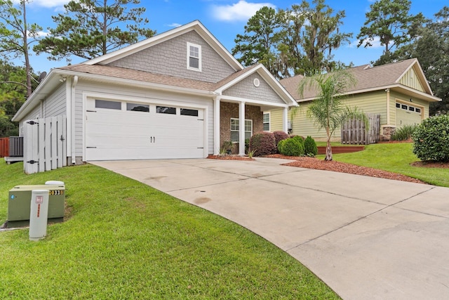 view of front of house featuring a front lawn and a garage