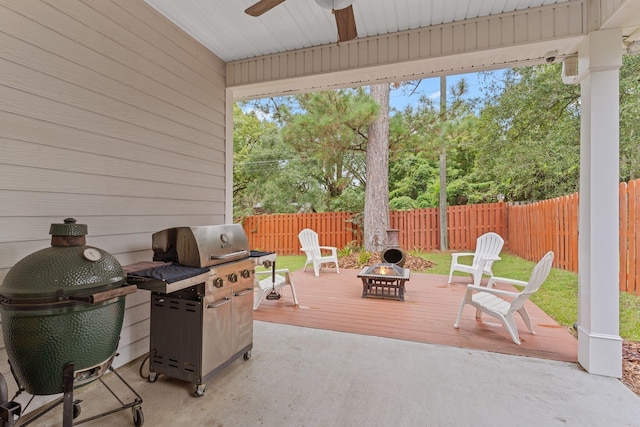 view of patio with an outdoor fire pit, grilling area, and ceiling fan