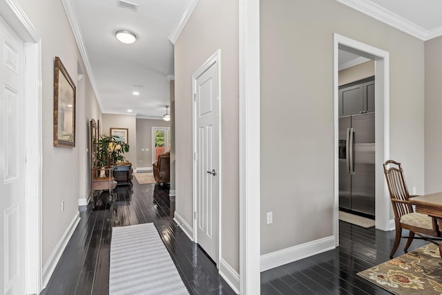 hall featuring crown molding and dark hardwood / wood-style floors