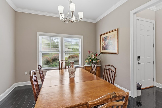 dining space featuring dark wood-type flooring, crown molding, and a chandelier