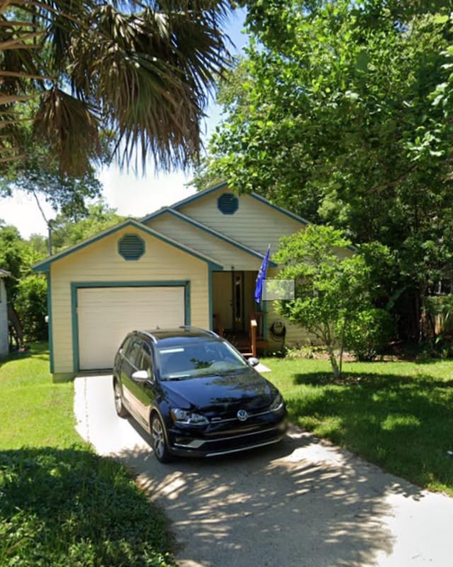 1404 Jackson St, Tallahassee, FL 32303 - single story home with driveway, a front lawn, and a garage
