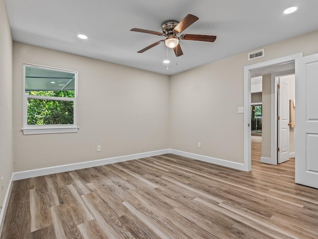 2191 Shangri La Ln E Unit 12B, Tallahassee, FL 32303 - unfurnished room featuring plenty of natural light, baseboards, light wood finished floors, and recessed lighting