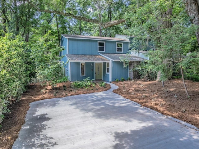 2191 Shangri La Ln E Unit 12B, Tallahassee, FL 32303 - traditional-style home with roof with shingles and covered porch
