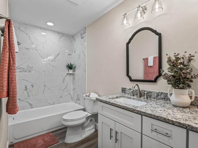 2191 Shangri La Ln E Unit 12B, Tallahassee, FL 32303 - bathroom featuring vanity, toilet, wood finished floors, and shower / bath combination
