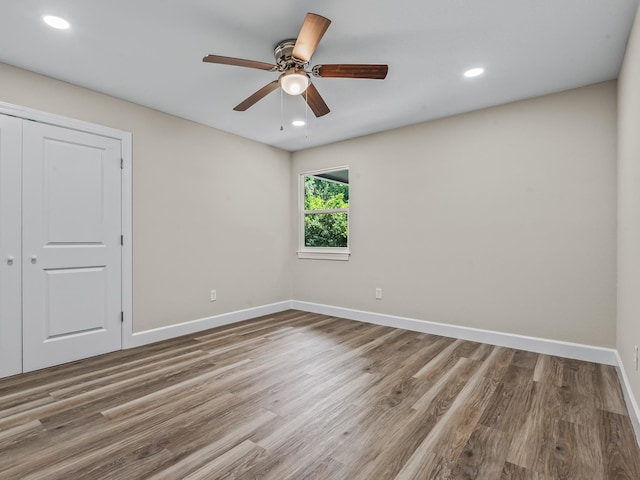 2191 Shangri La Ln E Unit 12B, Tallahassee, FL 32303 - spare room featuring baseboards, wood finished floors, recessed lighting, and a ceiling fan