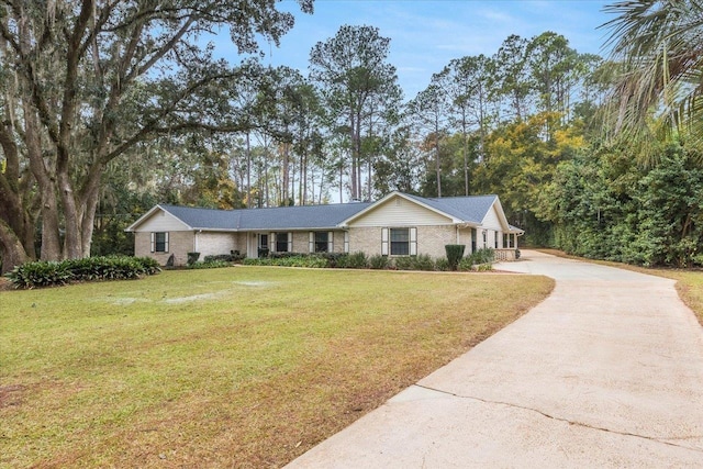 ranch-style house with a front lawn