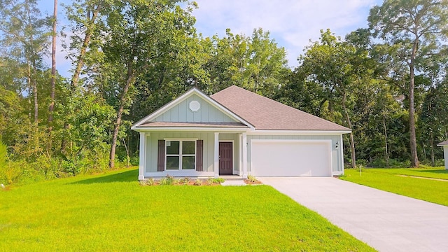 view of front facade with a garage and a front lawn