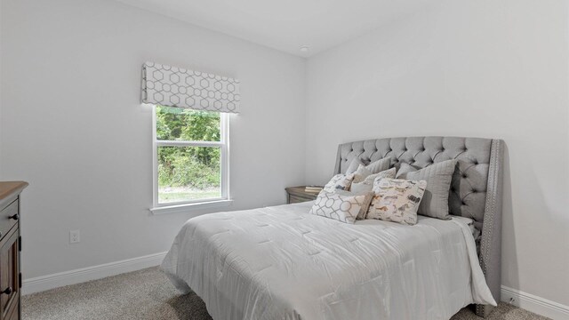 bedroom with light colored carpet