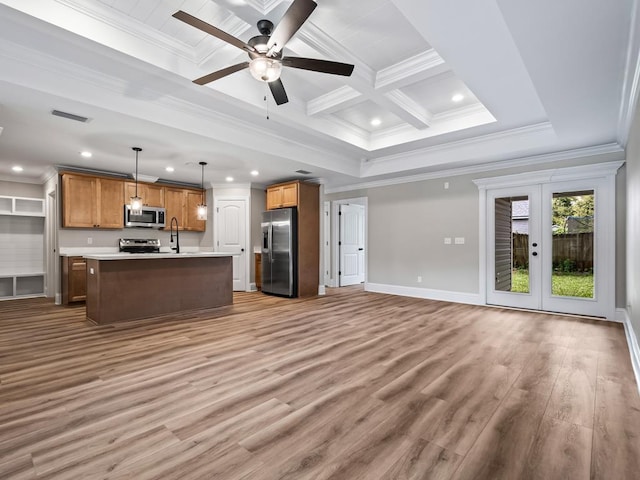 161 Broken Bow Trl, Crawfordville, FL 32327 - kitchen with visible vents, a sink, open floor plan, stainless steel appliances, and light countertops