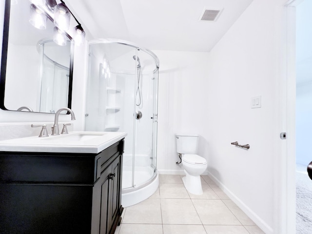 bathroom with vanity, toilet, an enclosed shower, and tile patterned flooring