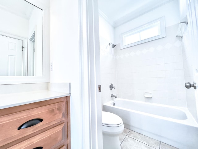 full bathroom with toilet, ornamental molding, vanity, tiled shower / bath combo, and tile patterned flooring